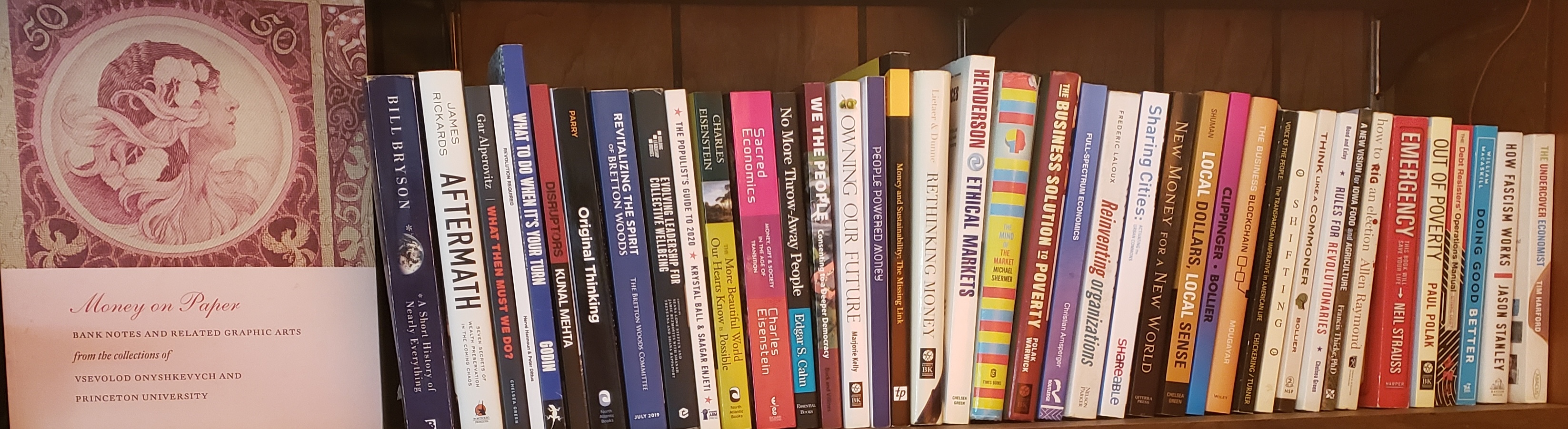 Bookshelf of regenerative economics and systems design literature